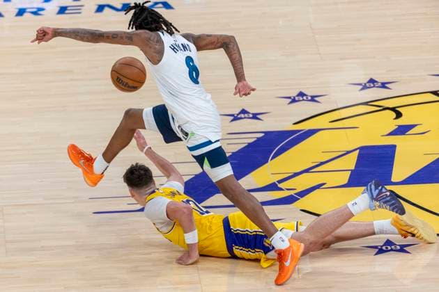 October 24, 2025, Los Angeles, California, USA: Minnesota Timberwolves Bones Hyland (8) leaps over Los Angeles LakersÃ¢â‚¬â ¢ Jake LaRavia (12) during an NBA, Basketball Herren, USA basketball game, in Los Angeles Friday, Oct. 24, 2025. Los Angeles USA - ZUMAc68_ 20251024_zaf_c68_049 Copyright: xRingoxChiux