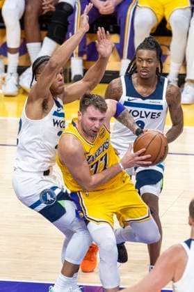 October 24, 2025, Los Angeles, California, USA: Los Angeles LakersÃ¢â‚¬â ¢ Luka DonÄÂiÄ¡ (77) drives against Minnesota Timberwolves Jaylen Clark (22) during an NBA, Basketball Herren, USA basketball game, in Los Angeles Friday, Oct. 24, 2025. Los Angeles USA - ZUMAc68_ 20251024_zaf_c68_058 Copyright: xRingoxChiux