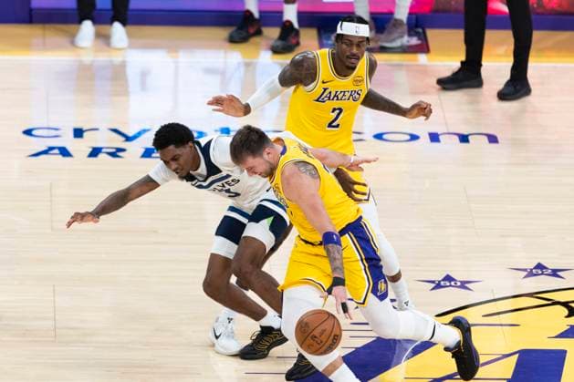 October 24, 2025, Los Angeles, California, USA: Los Angeles LakersÃ¢â‚¬â ¢ Luka DonÄÂiÄ¡ (77) drives around a screen set by Jarred Vanderbilt (2) defended by Minnesota Timberwolves Jaden McDaniels (3) during an NBA, Basketball Herren, USA basketball game, in Los Angeles Friday, Oct. 24, 2025. Los Angeles USA - ZUMAc68_ 20251024_zaf_c68_071 Copyright: xRingoxChiux