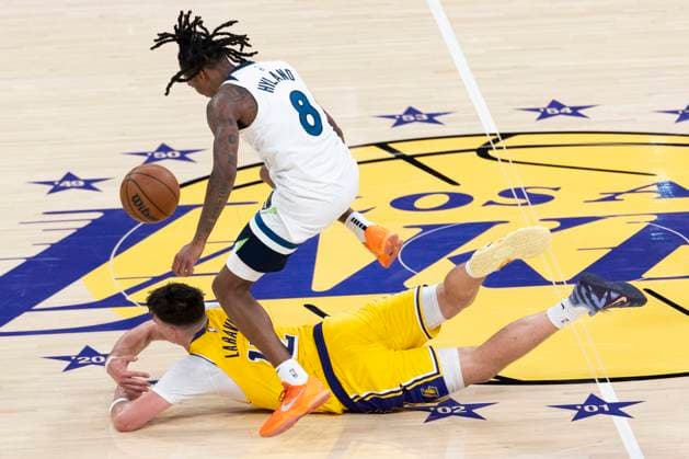 October 24, 2025, Los Angeles, California, USA: Minnesota Timberwolves Bones Hyland (8) leaps over Los Angeles LakersÃ¢â‚¬â ¢ Jake LaRavia (12) during an NBA, Basketball Herren, USA basketball game, in Los Angeles Friday, Oct. 24, 2025. Los Angeles USA - ZUMAc68_ 20251024_zaf_c68_072 Copyright: xRingoxChiux