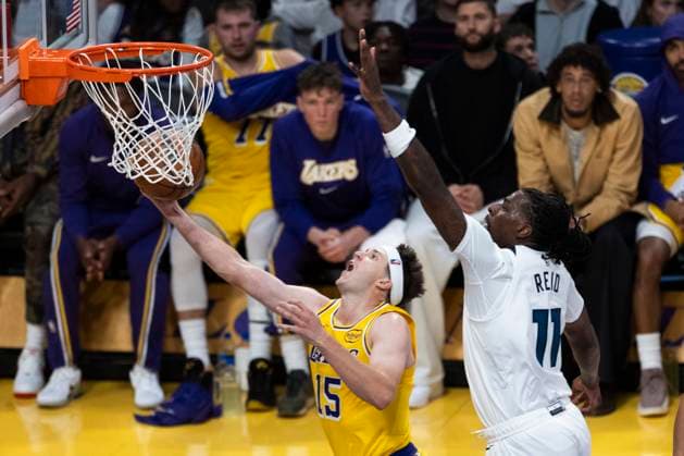October 24, 2025, Los Angeles, California, USA: Los Angeles LakersÃ¢â‚¬â ¢ Austin Reaves (15) goes past Minnesota Timberwolves Naz Reid (11) to the basket during an NBA, Basketball Herren, USA basketball game, in Los Angeles Friday, Oct. 24, 2025. Los Angeles USA - ZUMAc68_ 20251024_zaf_c68_093 Copyright: xRingoxChiux