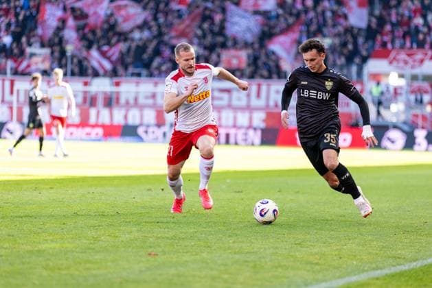 25.10.2025, Fussball, GER, Saison, 3.Liga, Saision 2025 2026, 12. Spieltag, SSV Jahn Regensburg - VFB Stuttgart II Michael Glück (Stuttgart II) am Ball gegen Eric Hottmann (SSV Jahn Regensburg) DFL REGULATIONS PROHIBIT ANY USE OF PHOTOGRAPHS AS IMAGE SEQUENCES AND OR QUASI-VIDEO.