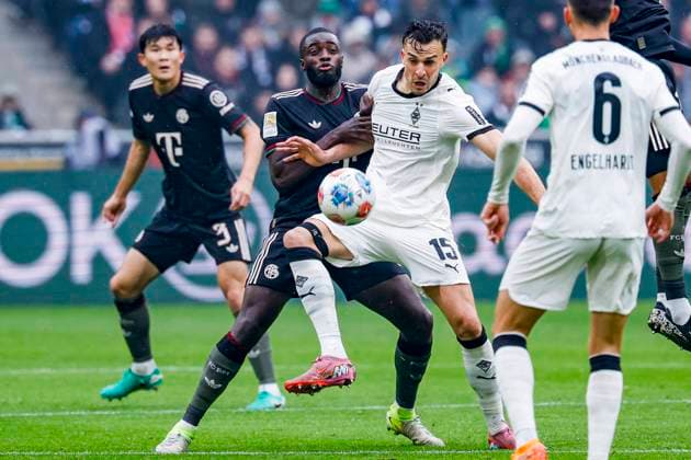 Haris Tabakovic of Borussia Mönchengladbach and Dayot Upamecano of FC Bayern München battle for the ball Borussia Mönchengladbach v FC Bayern München, Bundesliga, Borussia Mönchengladbach v FC Bayern München, Stadion im Borussia-Park, October 25, 2025, Mönchengladbach, Germany.