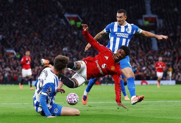 Amad Diallo of Manchester United, ManU goes over from a challenge by Maxim De Cuyper of Brighton & Hove Albion but no penalty kick was awarded Manchester United v Brighton and Hove Albion, Premier League, Football, Old Trafford, Manchester, UK - 25 Oct 2025Manchester Old Trafford United Kingdom EDITORIAL USE ONLY No use with unauthorised audio, video, data, fixture lists, club league logos or live services. Online in-match use limited to 120 images, no video emulation. No use in betting, games or single club league player publications. Copyright: xMattxWest Shutterstockx 15593413l