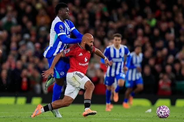 Manchester United, ManU v Brighton and Hove Albion Premier League 25 10 2025. Bryan Mbeumo (19) of Manchester United is fouled by Carlos Baleba (17) of Brighton & Hove Albion during the Premier League match between Manchester United and Brighton and Hove Albion at Old Trafford, Manchester, England on 25 October 2025. Manchester Old Trafford Greater Manchester England Editorial use only DataCo restrictions apply See www.football-dataco.com , Copyright: xConorxMolloyx PSI-23095-0061