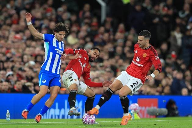 25th October 2025; Old Trafford, Manchester, England; Premier League Football, Manchester United, ManU versus Brighton and Hove Albion; Mats Wieffer of Brighton and Hove Albion competes for the ball with Matheus Cunha and Diogo Dalot of Manchester United  DavidxBlunsden