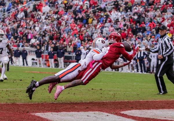 October 25, 2025, Fayetteville, Arkansas, USA: Auburn Tiger safety KENSLEY LOUIDOR-FAUSTIN (28) knocks a pass away from Arkansas Razorbacks wide receiver RAYLEN SHARPE (6) during Auburn s win over Arkansas at Donald W. Reynolds Razorback Stadium. Fayetteville USA - ZUMAs199 20251025_znp_s199_041 Copyright: xBrentxSoulex