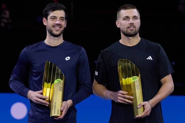 Lloyd Glasspool and Julian Cash of Great Britain pose with their trophies after their mens doubles finals win over Lucas Miedler of Austria and Francisco Cabral of Portugal at Erste Bank Open 2025 at Wiener Stadthalle on October 26, 2025 in Vienna, Austria. (Photo by Camilla Stolen, Imago) Vienna Austria Copyright: xCamillaxStolenx L1076858