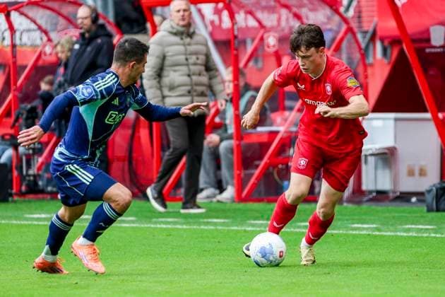 Sondre orjasaeter of FC Twente dribbles with the ball under pressure from Lucas Rosa of AFC Ajax FC Twente v AFC Ajax, Eredivisie, FC Twente v AFC Ajax, De Grolsch Veste, October 26, 2025, Enschede, Netherlands.