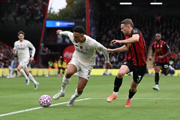 Bournemouth v Nottingham Forest Premier League 26 10 2025. Dan Ndoye (14) of Nottingham Forest on the attack battles for possession with Adrien Truffert (3) of AFC Bournemouth during the Premier League match between Bournemouth and Nottingham Forest at the Vitality Stadium, Bournemouth, England on 26 October 2025. Bournemouth Vitality Stadium Dorset England Editorial use only DataCo restrictions apply See www.football-dataco.com , Copyright: xGrahamxHuntx PSI-23107-0051