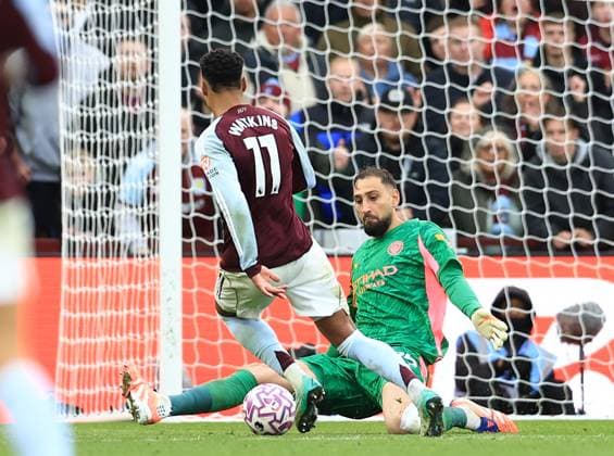 Birmingham, England, 26th October 2025. Gianluigi Donnarumma of Manchester City comes out to block Ollie Watkins of Aston Villa during the Aston Villa vs Manchester City Premier League match at Villa Park, Birmingham. Picture credit should read: Jessica Hornby Sportimage EDITORIAL USE ONLY. No use with unauthorised audio, video, data, fixture lists, club league logos or live services. Online in-match use limited to 120 images, no video emulation. No use in betting, games or single club league player publications. SPI_055_JH_Villa_City SPI-4240-0055