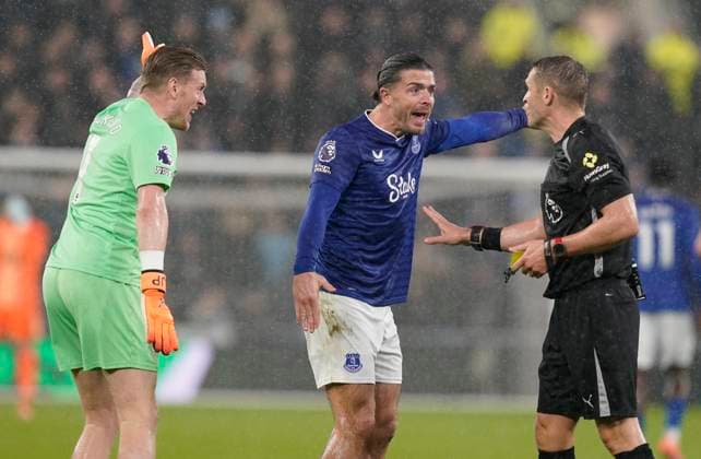 Liverpool, England, 26th October 2025. Jordan Pickford and Jack Grealish of Everton rage at the referee Craig Pawson during the Everton vs Tottenham Hotspur Premier League match at Hill Dickinson Stadium, Liverpool. Picture credit should read: Andrew Yates Sportimage EDITORIAL USE ONLY. No use with unauthorised audio, video, data, fixture lists, club league logos or live services. Online in-match use limited to 120 images, no video emulation. No use in betting, games or single club league player publications. SPI_052_AY_Everton_Spurs SPI-4241-0053
