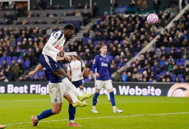 Liverpool, England, 26th October 2025. Pape Matar Sarr of Tottenham heads their third goal during the Everton vs Tottenham Hotspur Premier League match at Hill Dickinson Stadium, Liverpool. Picture credit should read: Andrew Yates Sportimage EDITORIAL USE ONLY. No use with unauthorised audio, video, data, fixture lists, club league logos or live services. Online in-match use limited to 120 images, no video emulation. No use in betting, games or single club league player publications. SPI_061_AY_Everton_Spurs SPI-4241-0061