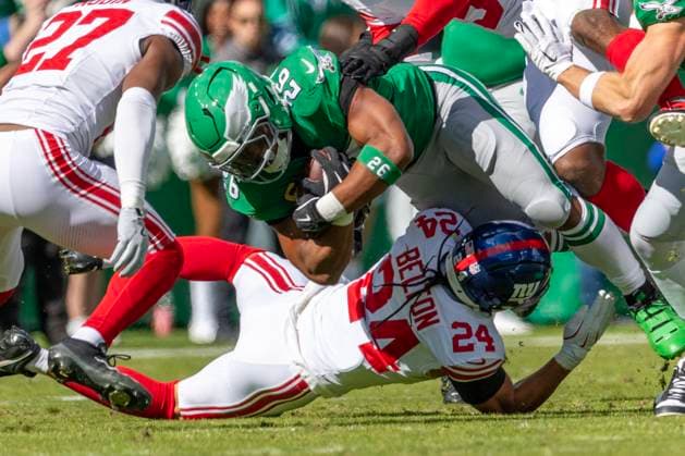Philadelphia Eagles running back Saquon Barkley (26) is brought down by New York Giants safety Dane Belton (24) during the first quarter at Lincoln Financial Field in Philadelphia on Sunday, October 26, 2025.  PHI20251026003 LAURENCExKESTERSON