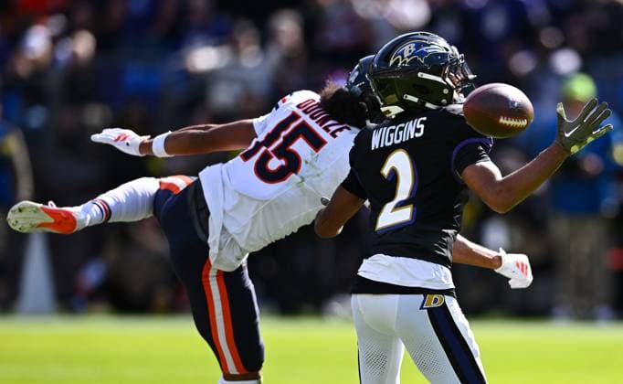 Baltimore Ravens cornerback Nate Wiggins (2) breaks up a pass intended for Chicago Bears wide receiver Rome Odunze (15) during the first quarter at M&T Bank Stadium in Baltimore, Maryland, on Sunday, October 26, 2025.  BAL20251026114 DAVIDxTULIS