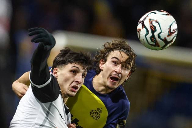 STVV s Andres Ferrari and Union s Kamiel Van De Perre fight for the ball during a soccer match between Royale Union Saint-Gilloise and Sint-Truidense VV, Sunday 26 October 2025 in Brussels, on day 12 of the 2025-2026 Jupiler Pro League first division of the Belgian championship. BRUNOxFAHY  x138044342x