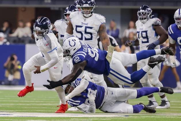 October 26, 2025, Indianapolis, Indiana, U.S: Indianapolis Colts defensive tackle Neville Gallimore (92) dives to tackle Tennessee Titans quarterback Cam Ward (1) on a run during the game between the Tennessee Titans and the Indianapolis Colts at Lucas Oil Stadium, Indianapolis, Indiana. Indianapolis U.S - ZUMAs304 20251026_zaf_s304_026 Copyright: xScottxStuartx