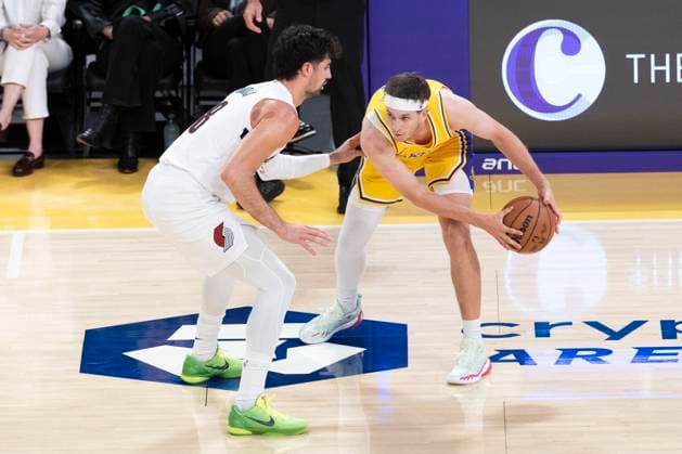 October 27, 2025, Los Angeles, California, USA: Los Angeles LakersÃ¢â‚¬â ¢ Austin Reaves (15) is defended by Portland Trail Blazers Deni Avdija (8) during an NBA, Basketball Herren, USA basketball game, in Los Angeles Monday, Oct. 27, 2025. Los Angeles USA - ZUMAc68_ 20251027_zaf_c68_011 Copyright: xRingoxChiux