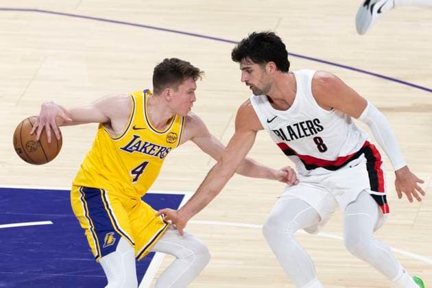 October 27, 2025, Los Angeles, California, USA: Los Angeles LakersÃ¢â‚¬â ¢ Dalton Knecht (4) is defended by Portland Trail Blazers Deni Avdija (8) during an NBA, Basketball Herren, USA basketball game, in Los Angeles Monday, Oct. 27, 2025. Los Angeles USA - ZUMAc68_ 20251027_zaf_c68_031 Copyright: xRingoxChiux