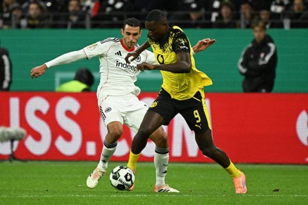 (251029) -- FRANKFURT, Oct. 29, 2025 -- Ellyes Skhiri (L) of Eintracht Frankfurt vies with Serhou Guirassy of Borussia Dortmund during the German Cup football second round match between Eintracht Frankfurt and Borussia Dortmund in Frankfurt, Germany, Oct. 28, 2025. (Photo by Xinhua) (SP)GERMANY-FRANKFURT-FOOTBALL-GERMAN CUP-FRANKFURT VS DORTMUND UlrichxHufnagel 