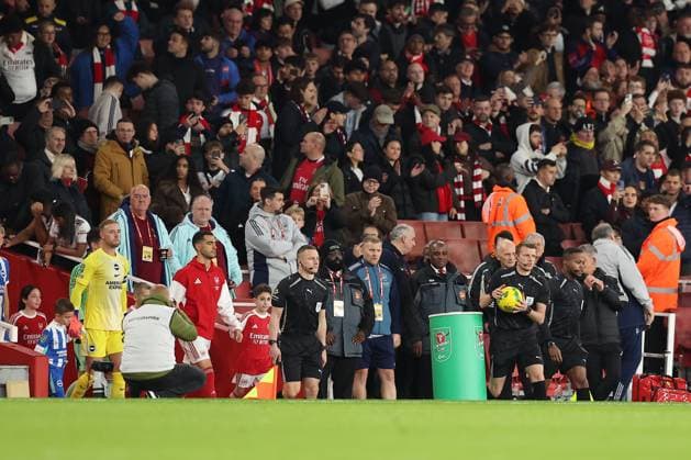 29th October 2025; Emirates Stadium, London, England; EFL Carabao Cup Football, Arsenal versus Brighton and Hove Albion; referee Sam Barrott leads the players out for the start of the match  KatiexChan