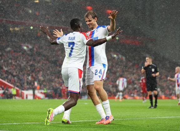 Liverpool, England, 29th October 2025. Ismaila Sarr of Crystal Palace (l) celebrates scoring their second goal with Borna Sosa of Crystal Palace (r) during the Liverpool vs Crystal Palace Carabao Cup match at Anfield, Liverpool. Picture credit should read: Jessica Hornby Sportimage EDITORIAL USE ONLY. No use with unauthorised audio, video, data, fixture lists, club league logos or live services. Online in-match use limited to 120 images, no video emulation. No use in betting, games or single club league player publications. SPI_017_JH_Liverpool_Crystal_Palace SPI-4246-0017