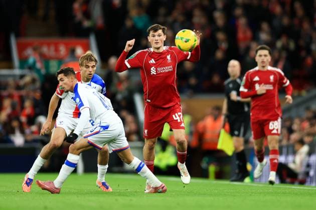 Liverpool, England, 29th October 2025. Calvin Ramsay of Liverpool passes the ball whilst under pressure from Yeremy Pino of Crystal Palace during the Liverpool vs Crystal Palace Carabao Cup match at Anfield, Liverpool. Picture credit should read: Jessica Hornby Sportimage EDITORIAL USE ONLY. No use with unauthorised audio, video, data, fixture lists, club league logos or live services. Online in-match use limited to 120 images, no video emulation. No use in betting, games or single club league player publications. SPI_040_JH_Liverpool_Crystal_Palace SPI-4246-0040