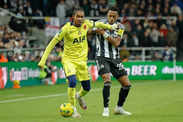 29th October 2025; St James Park, Newcastle, England; EFL Carabao Cup Football, Newcastle United versus Tottenham Hotspur; Djed Spence of Tottenham Hotspur holds off Joe Willock of Newcastle United  CraigxCowan