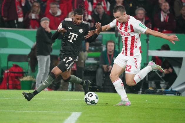 Fussball, DFB Pokal saison 2025 2026 1.FC Köln vs FC Michael Olise FC Bayern München, Kristoffer Lund Hansen FC Köln copyright Gladys Chai von der Laage DFB regulations prohibit any use of photographs as image sequences and or quasi-video.