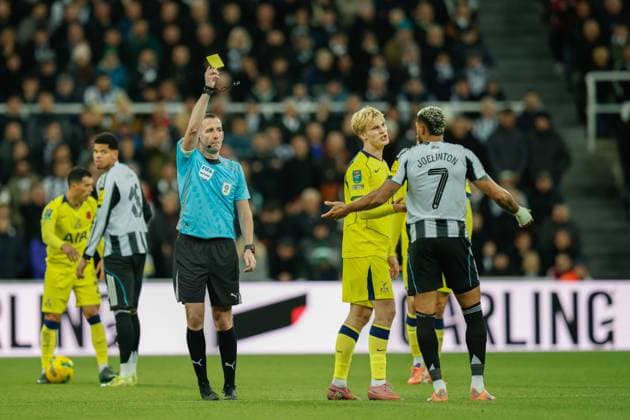 29th October 2025; St James Park, Newcastle, England; EFL Carabao Cup Football, Newcastle United versus Tottenham Hotspur; referee Chris Kavanagh shows Joelinton of Newcastle United a yellow card  CraigxCowan