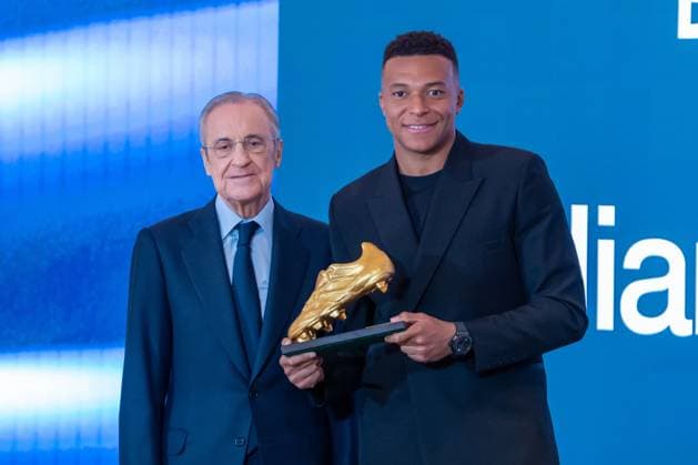 Real Madrid CF™s Kylian Mbappe (r) with the President Florentino Perez during the ceremony of the Golden Boot 2024-25. October 31, 2025. (20251031300)