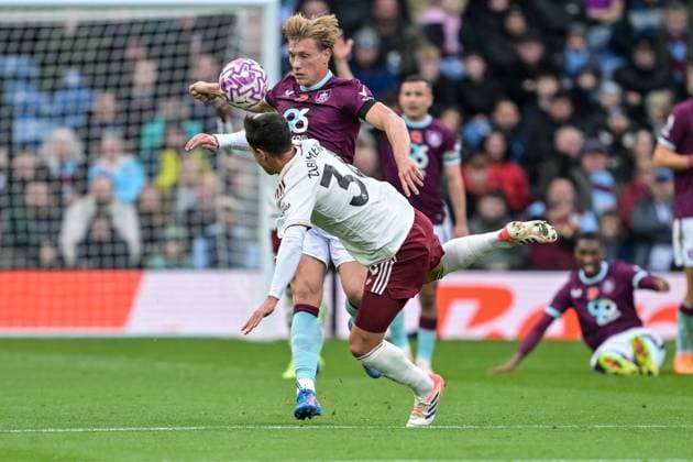 1st November 2025; Turf Moor, Burnley, Lancashire, England; Premier League Football, Burnley versus Arsenal; Mart& xed;n Zubimendi of Arsenal trips over during the tussle with Zian Flemming of Burnley  LeexDurkin