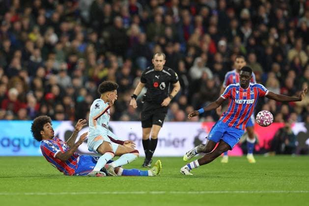 1st November 2025; Selhurst Park, Selhurst, London, England; Premier League Football, Crystal Palace versus Brentford; Kevin Schade of Brentford is tackled by Chris Richards of Crystal Palace  KatiexChan