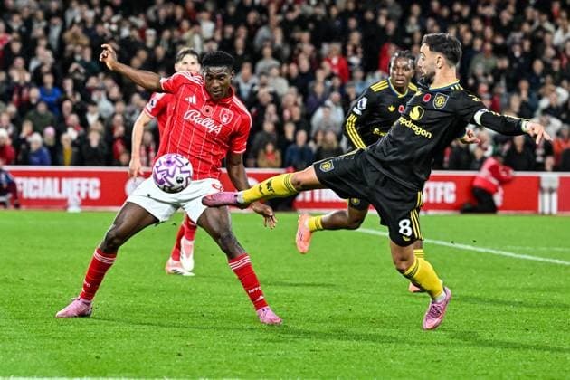 1st November 2025; The City Ground, Nottingham, England; Premier League Football, Nottingham Forest versus Manchester United, ManU Bruno Fernandes of Manchester United shoots past Taiwo Awoniyi of Nottingham Forest  GodfreyxPitt