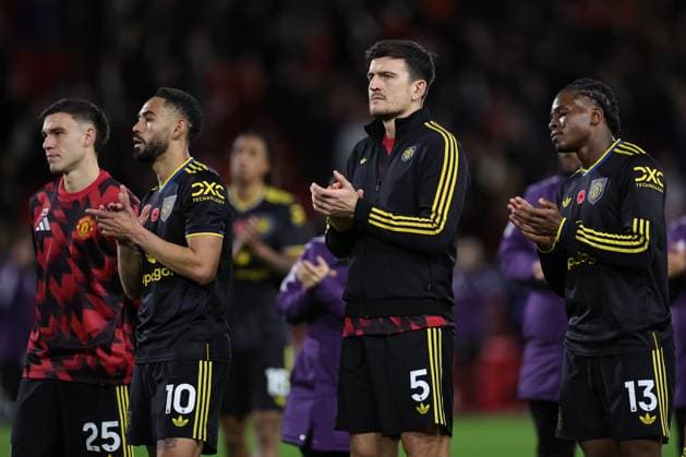 NOTTINGHAM, ENGLAND - NOVEMBER 1: Harry Maguire of Manchester United, ManU Matheus Cunha of Manchester United, Manuel Ugarte of Manchester United and Patrick Dorgu of Manchester United applaud the fans on the final whistle during the Premier League match between Nottingham Forest and Manchester United at City Ground on November 1, 2025 in Nottingham, England. (Photo by James Holyoak) SPO 