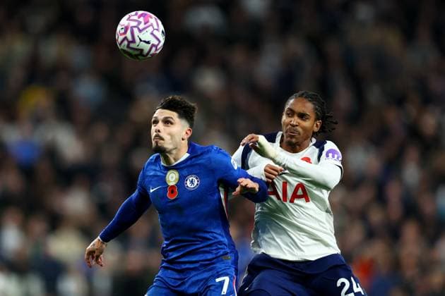 London, England, 1st November 2025. Pedro Neto of Chelsea and Djed Spence of Tottenham Hotspur challenge for the ball during the Tottenham Hotspur vs Chelsea Premier League match at the Tottenham Hotspur Stadium, London. Picture credit should read: Paul Terry Sportimage EDITORIAL USE ONLY. No use with unauthorised audio, video, data, fixture lists, club league logos or live services. Online in-match use limited to 120 images, no video emulation. No use in betting, games or single club league player publications. SPI_063_PT_Tottenham_Chelsea SPI-4252-0063