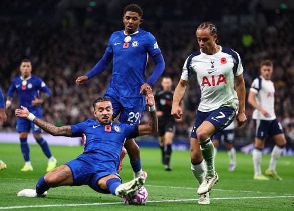 London, England, 1st November 2025. Malo Gusto of Chelsea and Xavi Simons of Tottenham Hotspur challenge for the ball during the Tottenham Hotspur vs Chelsea Premier League match at the Tottenham Hotspur Stadium, London. Picture credit should read: Paul Terry Sportimage EDITORIAL USE ONLY. No use with unauthorised audio, video, data, fixture lists, club league logos or live services. Online in-match use limited to 120 images, no video emulation. No use in betting, games or single club league player publications. SPI_070_PT_Tottenham_Chelsea SPI-4252-0070