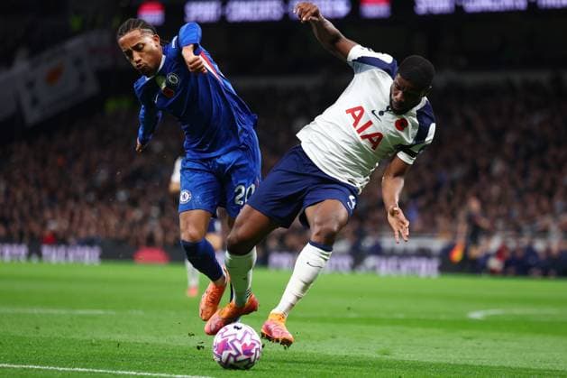 London, England, 1st November 2025. Pedro Neto of Chelsea Kevin Danso of Tottenham Hotspur challenge for the ball during the Tottenham Hotspur vs Chelsea Premier League match at the Tottenham Hotspur Stadium, London. Picture credit should read: Paul Terry Sportimage EDITORIAL USE ONLY. No use with unauthorised audio, video, data, fixture lists, club league logos or live services. Online in-match use limited to 120 images, no video emulation. No use in betting, games or single club league player publications. SPI_073_PT_Tottenham_Chelsea SPI-4252-0073