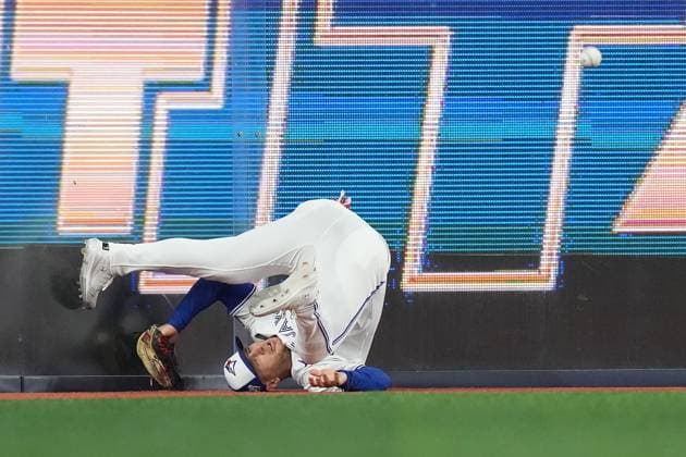 November 1, 2025, Toronto, On, Canada: Toronto Blue Jays center fielder Daulton Varsho (5) tumbles after trying to make a catch as the ball bounces away during fourth inning Game 7 World Series playoff MLB, Baseball Herren, USA baseball action against the Los Angeles Dodgers in Toronto on Saturday, Nov. 1, 2025. Canada News - November 1, 2025  - ZUMAc35_ 20251101_zaf_c35_192 Copyright: xNathanxDenettex