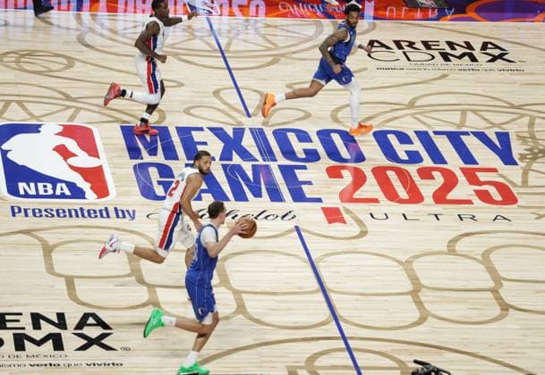(251102) -- MEXICO CITY, Nov. 2, 2025 -- Dallas Mavericks Cooper Flagg (bottom) dribbles the ball during the 2025-2026 NBA, Basketball Herren, USA regular season match between Detroit Pistons and Dallas Mavericks in Mexico City, capital of Mexico, on Nov. 1, 2025. (Photo by Xinhua) (SP)MEXICO-MEXICO CITY-BASKETBALL-NBA-PISTONS VS MAVERICKS FranciscoxCanedo 
