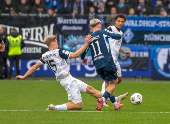 02.11.2025, xhettx, Fussball 3.Liga, TSG 1899 Hoffenheim U23 - SV Waldhof Mannheim v.l. Malte Karbstein (SV Waldhof Mannheim, 15) mit einer grätsche gegen Paul Hennrich (TSG Hoffenheim U23, 11) (DFL DFB REGULATIONS PROHIBIT ANY USE OF PHOTOGRAPHS as IMAGE SEQUENCES and or QUASI-VIDEO) Hoffenheim