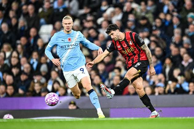 2nd November 2025; Etihad Stadium, Manchester, Lancashire, England; Premier League Football, Manchester City versus AFC Bournemouth; Marcos Senesi of AFC Bournemouth clears the ball past Erling Haaland of Manchester City  GodfreyxPitt