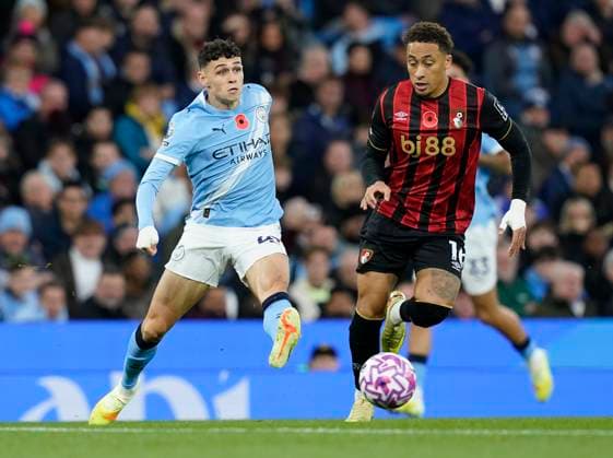 Manchester, England, 2nd November 2025. Phil Foden of Manchester City (L) is challenged by Marcus Tavernier of Bournemouth during the Manchester City vs AFC Bournemouth Premier League match at the Etihad Stadium, Manchester. Picture credit should read: Andrew Yates Sportimage EDITORIAL USE ONLY. No use with unauthorised audio, video, data, fixture lists, club league logos or live services. Online in-match use limited to 120 images, no video emulation. No use in betting, games or single club league player publications. SPI_020_AY_MAN_CITY_BOURN SPI-4256-0021
