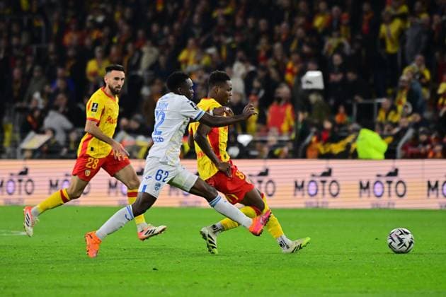 FOOTBALL : Lens vs Lorient - Ligue 1 - 02 11 2025 Mamadou Sangare ( 8 - Lens ) and Arthur Avom Ebong ( 62 - FC Lorient ) during the Ligue 1 match between RC Lens and FC Lorient at Stade Felix Bollaert on November 02, 2025 in Lens, France. ( Photo by federico pestellini psnewz ) - LensFrance  Copyright: xFedericoxPestellinix
