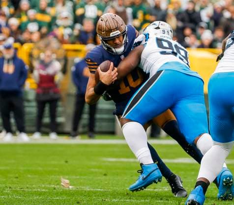 Green Bay Packers quarterback Jordan Love (L) is sacked by Carolina Panthers defensive tackle Turk Wharton (R) during the first half of the NFL, American Football Herren, USA game between the Carolina Panthers and the Green Bay Packers at Lambeau Field in Green Bay, Wisconsin on Sunday, November 2, 2025.  GBW20251102823 TANNENxMAURY