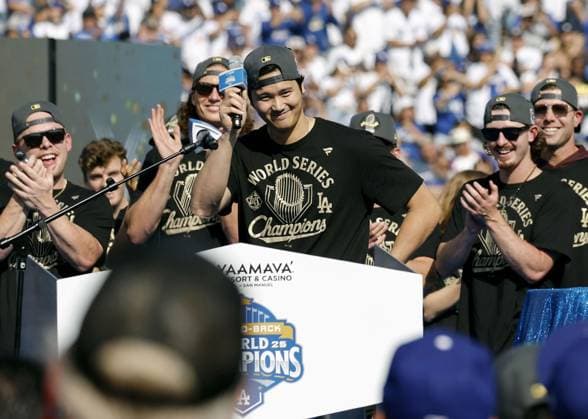 Dodgers World Series victory celebration Los Angeles Dodgers two-way player Shohei Ohtani (C) speaks during an event to celebrate the baseball team s World Series victory at Dodger Stadium in Los Angeles on Nov. 3, 2025.  A14AA0005004728P