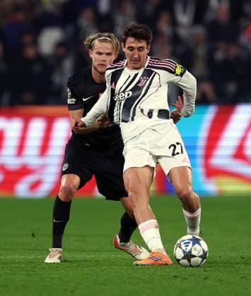 (251105) -- TURIN, Nov. 5, 2025 () -- Juventus Andrea Cambiaso (R) vies with Sporting s Morten Hjulmand during the UEFA Champions League football match between Juventus and Sporting in Turin, Italy, Nov. 4, 2025. () (SP)ITALY-TURIN-FOOTBALL-UEFA CHAMPIONS LEAGUE-JUVENTUS VS SPORTING CP Xinhua 