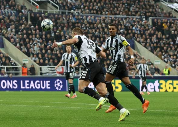 Newcastle Upon Tyne, England, 5th November 2025. Dan Burn of Newcastle United scoring during the Newcastle United vs Athletic Club UEFA Champions League match at St. James Park, Newcastle Upon Tyne. Picture credit should read: Nigel Roddis Sportimage EDITORIAL USE ONLY. No use with unauthorised audio, video, data, fixture lists, club league logos or live services. Online in-match use limited to 120 images, no video emulation. No use in betting, games or single club league player publications. SPI_028_NR_NEWC_ATHL SPI-4267-0028