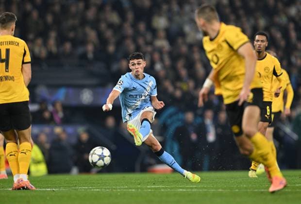 Manchester, England, 5th November 2025. Phil Foden of Manchester City scores the first goal during the Manchester City vs Borussia Dortmund UEFA Champions League match at the Etihad Stadium, Manchester. Picture credit should read: Cody Froggatt Sportimage EDITORIAL USE ONLY. No use with unauthorised audio, video, data, fixture lists, club league logos or live services. Online in-match use limited to 120 images, no video emulation. No use in betting, games or single club league player publications. SPI_021_CF_Man_City_Dortmund SPI-4268-0041