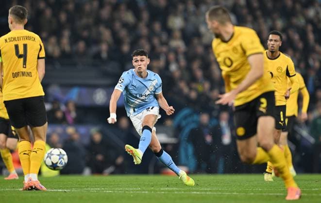 Manchester, England, 5th November 2025. Phil Foden of Manchester City scores the first goal during the Manchester City vs Borussia Dortmund UEFA Champions League match at the Etihad Stadium, Manchester. Picture credit should read: Cody Froggatt Sportimage EDITORIAL USE ONLY. No use with unauthorised audio, video, data, fixture lists, club league logos or live services. Online in-match use limited to 120 images, no video emulation. No use in betting, games or single club league player publications. SPI_022_CF_Man_City_Dortmund SPI-4268-0042